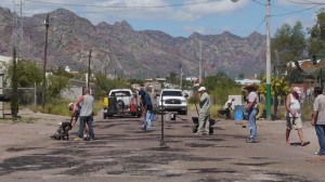 Local Americans volunteer  time to fill potholes